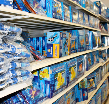 Seasonal promotional display with pool opening kits and start-up chemicals