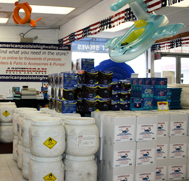 Pool accessories section featuring floats, maintenance tools, and toys