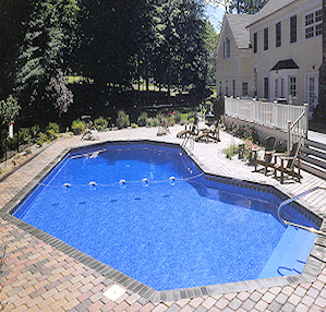Classic Grecian-shaped in-ground pool with symmetrical steps at both ends