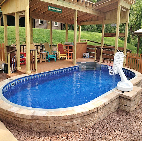 Freeform pool design with natural stone coping and integrated spa