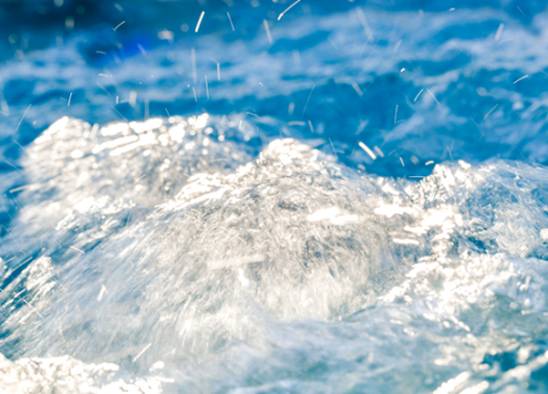 Tropic Seas swim spa showing the swim current end and the spa seating area