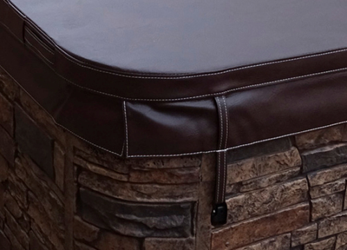 Swim spa installed in a backyard with a beautiful deck surround