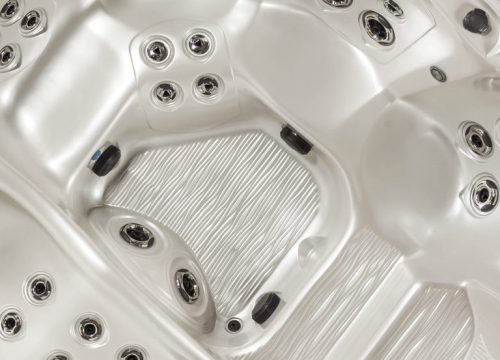 Luxurious Tropic Seas spa installed on a stone patio